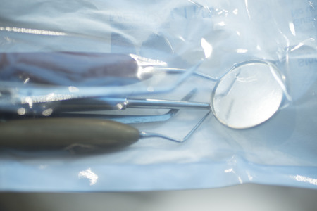 Dental instrumenation dentist drill and cleaning tool in denstists surgery clinic vertical color photo in hygiene plastic wrap ready for use.の写真素材