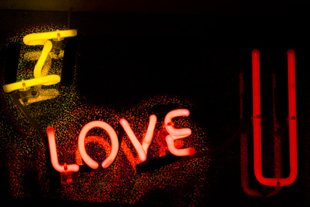 Neon sign at night in street photo.の写真素材