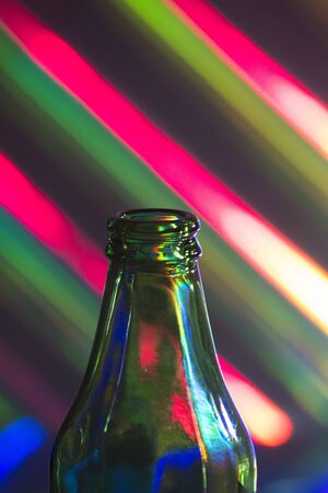 Bottle of beer and multicolor background photo.の写真素材