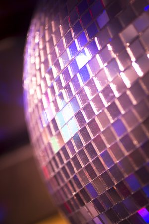 Disco ball in Ibiza house techno dance music wedding reception party in nightclub with colored lighting effect disco lights.の写真素材