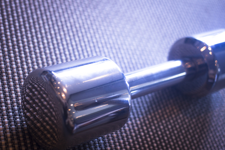 Dumbbell gym metal weights in exercise room in sports bodybuilder gym health club fitness studio for bodybuilding and weight training.の写真素材