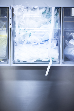 Traumatology orthopedic surgery hospital emergency operating room prepared for arthroscopy operation photo masks brushes supplies.の写真素材