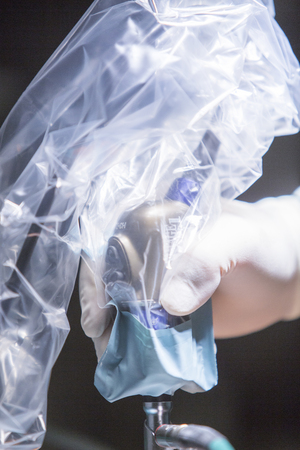 Traumatology orthopedic surgery hospital emergency operating room prepared for knee torn meniscus arthroscopy operation photo of drip fluids tube, arthroscope, arthroscopy camera and probe.の写真素材