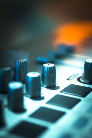 DJ console cd mp4 deejay mixing desk buttons and knobs in Ibiza house techno dance music wedding...