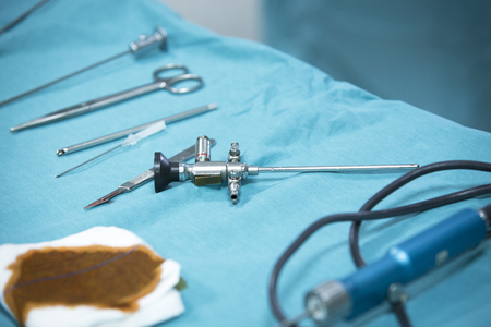 Traumatology orthopedic surgery hospital emergency operating room prepared for arthroscopy operation camera on table with equipmentの写真素材