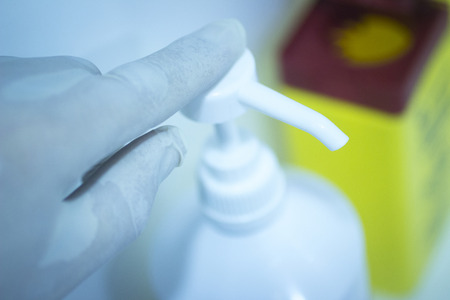 Dental instrumentation dentist hygiene tooth dental cleaning tool in the hand of dentist in dentists surgery clinic artistic color photo with shallow depth of focus.の写真素材