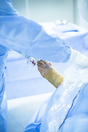 Hospital emergency orthopedics and traumatology surgery operating room medical clinic real life photo in foot, ankle and leg arthroscopy orthopedic operation.の写真素材