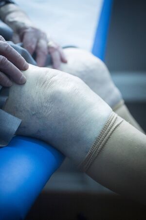 Patient leg in physical therapy physiotherapy clinic in medical center hospital rehabilitation room.の写真素材