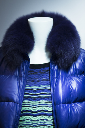 Shop dummy fashion mannequin in department store boutique window wearing current trends in garments.の写真素材