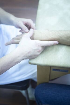 Patient hand in physical therapy physiotherapy clinic in medical center hospital rehabilitation...