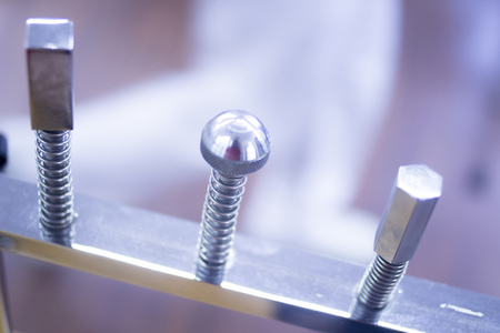 Hand, wrist and fingers physiotherapy rehabilitation treatment from orthopedic surgery in a hospital clinic physiotherapists room screw to build strength in his finger, hands and wrists muscles.の写真素材