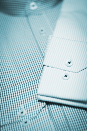 Shop dummy fashion mannequin in department store boutique window wearing current trends in garments.の写真素材