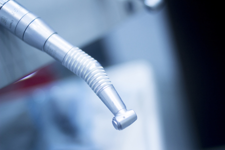 Dental hygiene instrumenation dentist drill cleaning tool in clinic surgery office used to treat tooth decay.の写真素材