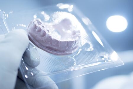 Dental mold dentist clay teeth plate ceramic colored cast model in steril plastic vacuum wrap...