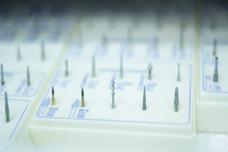 Dental equipment in dentist office clinic surgery used to treat tooth decay, fillings, gum disease and orthodontics treatments.の写真素材