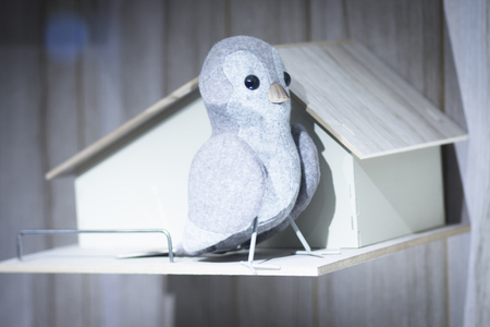 Toy bird dove pidgeon nest house photo.の写真素材