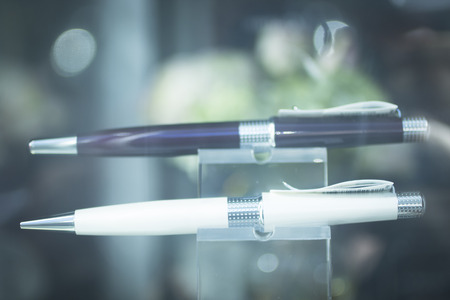 Shop store window writing pen on sale photo.の写真素材