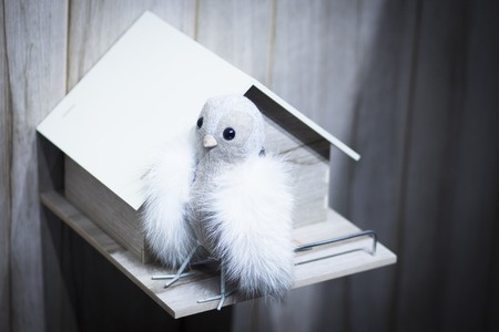 Toy bird dove pidgeon nest house photo.の写真素材