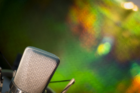 Audio recording vocal studio voice microphone with anti shock mount and built in anti pop filter for singing and voiceover actors doing voiceovers.の写真素材