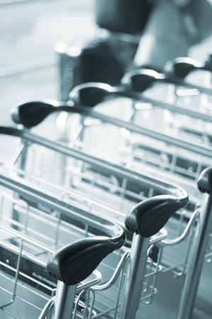 Airport luggage trolleys to push baggage and suitcases photo.の写真素材