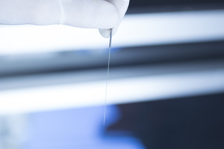 Acupuncture needle used for dry needling rehabilitation medical treament for physiotherapy and pain due to physical injury in the hand of the doctor.の写真素材