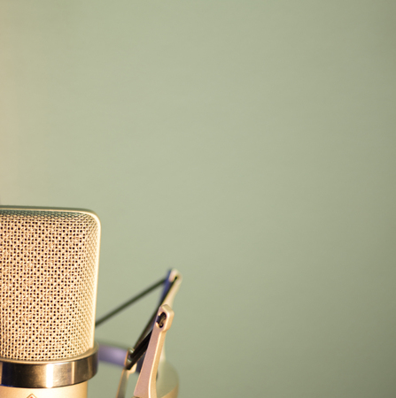 Audio recording vocal studio voice microphone with anti shock mount and built in anti pop filter for singing and voiceover actors doing voiceovers.の写真素材