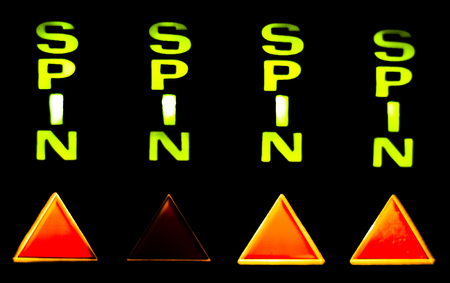 One arm bandit slot machine in casino at night photograph.