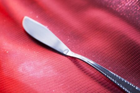 Fish knife on dinner table place setting in restaurant wedding party photo.の写真素材