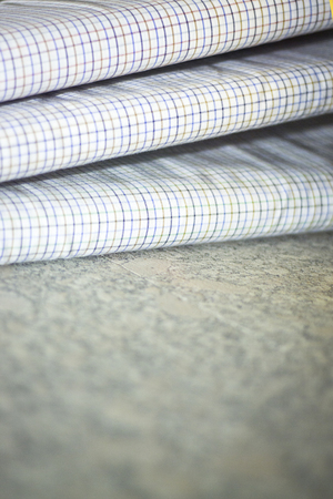 Cotton shirt cloth for meade to measure shirts in tailors retail store window photo.の写真素材