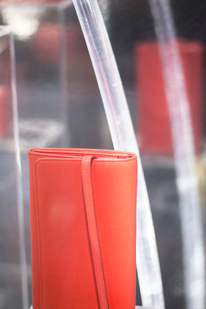 Shop window luxury fashion clothes store designer leather handbag photograph.の写真素材