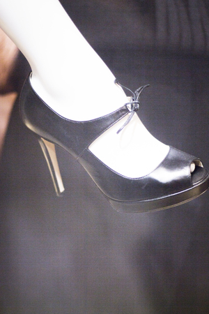 Women's leather shoes in fashion store window display photo.の写真素材