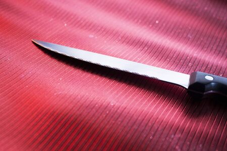Knife on dinner table place setting in restaurant wedding party photo.の写真素材