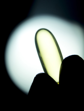 Cod liver fish oil omega 3 6 9 capsule health food suplement vitamin and mineral pill photo.の写真素材