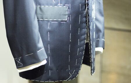 Store clothes dummy in men's suit shop photo