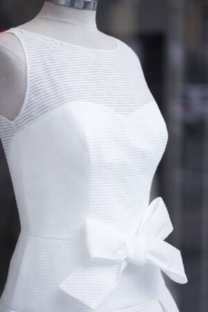 Wedding white dress bridal gown in store window on clothes mannequin.の写真素材