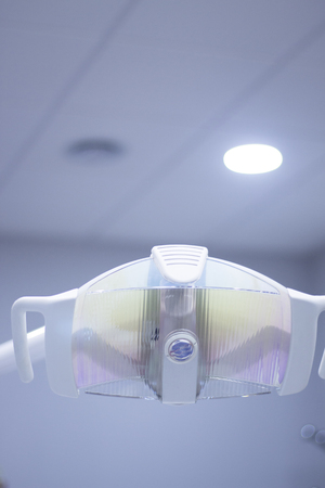 Dentist's chair dental lightl in hospital clinic.の写真素材