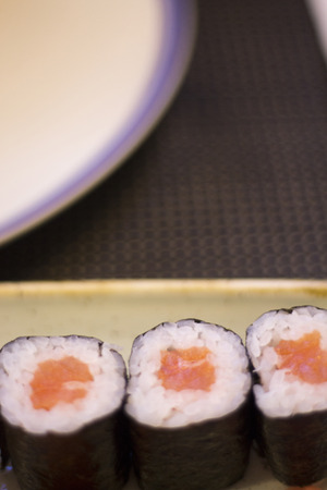 Japanese restaurant sushi oriental raw fish smoked salmon food dish and traditional Asian wooden chopsticks photo.の写真素材
