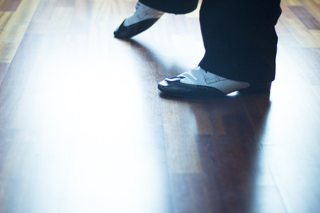 Male ballroom, standard, sport dance, latin and salsa dancer feet and shoes in dance academy school...
