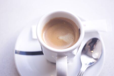 Expresso coffee cup and saucer in Italian restaurant cafe.