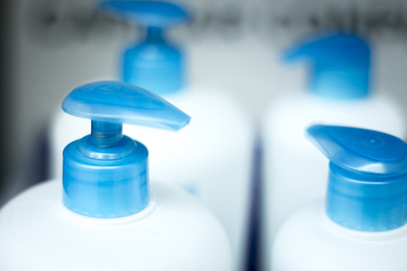 Cosmetic product plastic bottles in blue and white photo.の写真素材