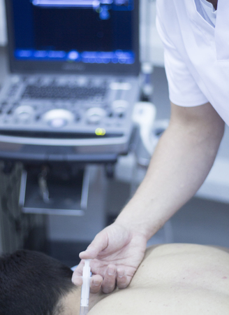 Ultrasound assisted ecography intratissue percutaneous electrolysis physical therapy injection physiotherapist treatment in hospital medical center IPE physiotherapy clinic.の写真素材