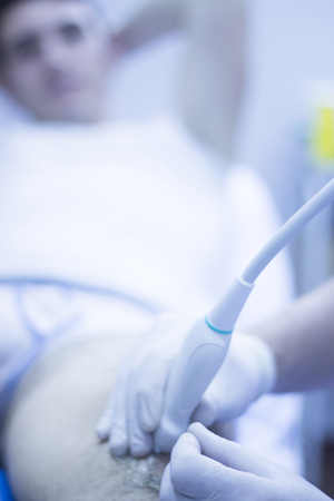 Ultrasound assisted EPI ecography intratissue percutaneous electrolysis physical therapy rehabilitation for knee and leg treatment in hospital IPE physiotherapy clinic.の写真素材