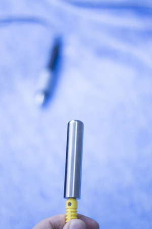 Electroacupunture cables connecting machine to needles used by acupunturist on patient in pain and injury acupunture with electrical pulse treatment.の写真素材