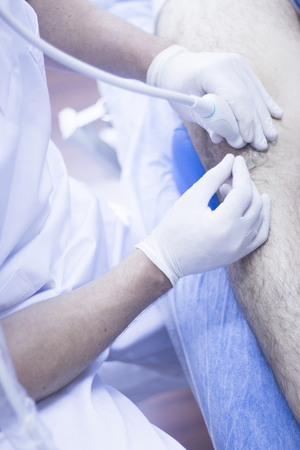 Ultrasound assisted EPI ecography intratissue percutaneous electrolysis physical therapy rehabilitation physiotherapist treatment in hospital medical center IPE physiotherapy clinic.の写真素材