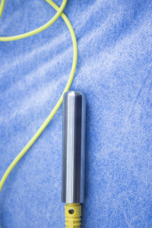 Electroacupunture cables connecting machine to needles used by acupunturist on patient in pain and injury acupunture with electrical pulse treatment.の写真素材