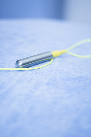 Electroacupunture cables connecting machine to needles used by acupunturist on patient in pain and injury acupunture with electrical pulse treatment.の写真素材