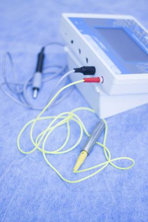 Electroacupunture cables connecting machine used by acupunturist on patient in pain and injury...
