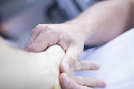 Myofascial osteopathy physiotherapy treatment by physiotherapist and osteopath in physical therapy rehabilitation treatment on patient on hand and wrist.の写真素材