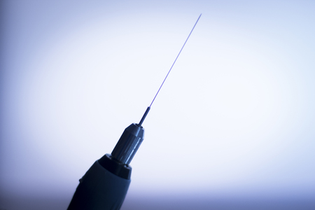 Electroacupunture dry needling needle connecting machine to needles used by acupunturist on patient for acupunture guided by EPI Intratissue Percutaneous Electrolisis.の写真素材