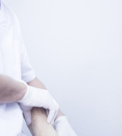 Myofascial osteopathy physiotherapy treatment by physiotherapist and osteopath in physical therapy rehabilitation treatment on patient on leg, ankle and foot.の写真素材